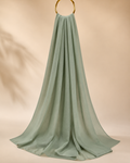 Plain sage green nida hijab draped elegantly