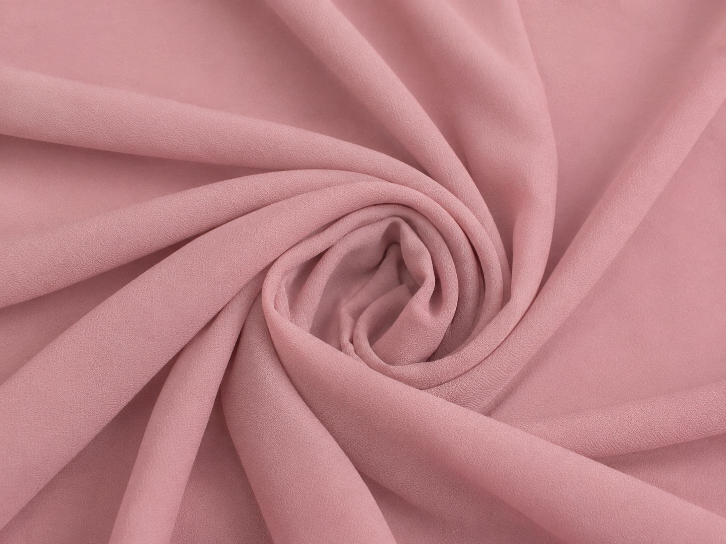 Dusty rose pink nida fabric close-up texture