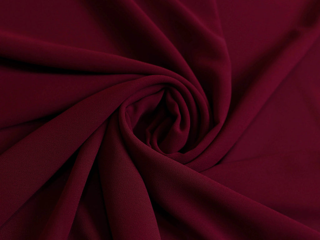 Plain maroon georgette hijab draped elegantly