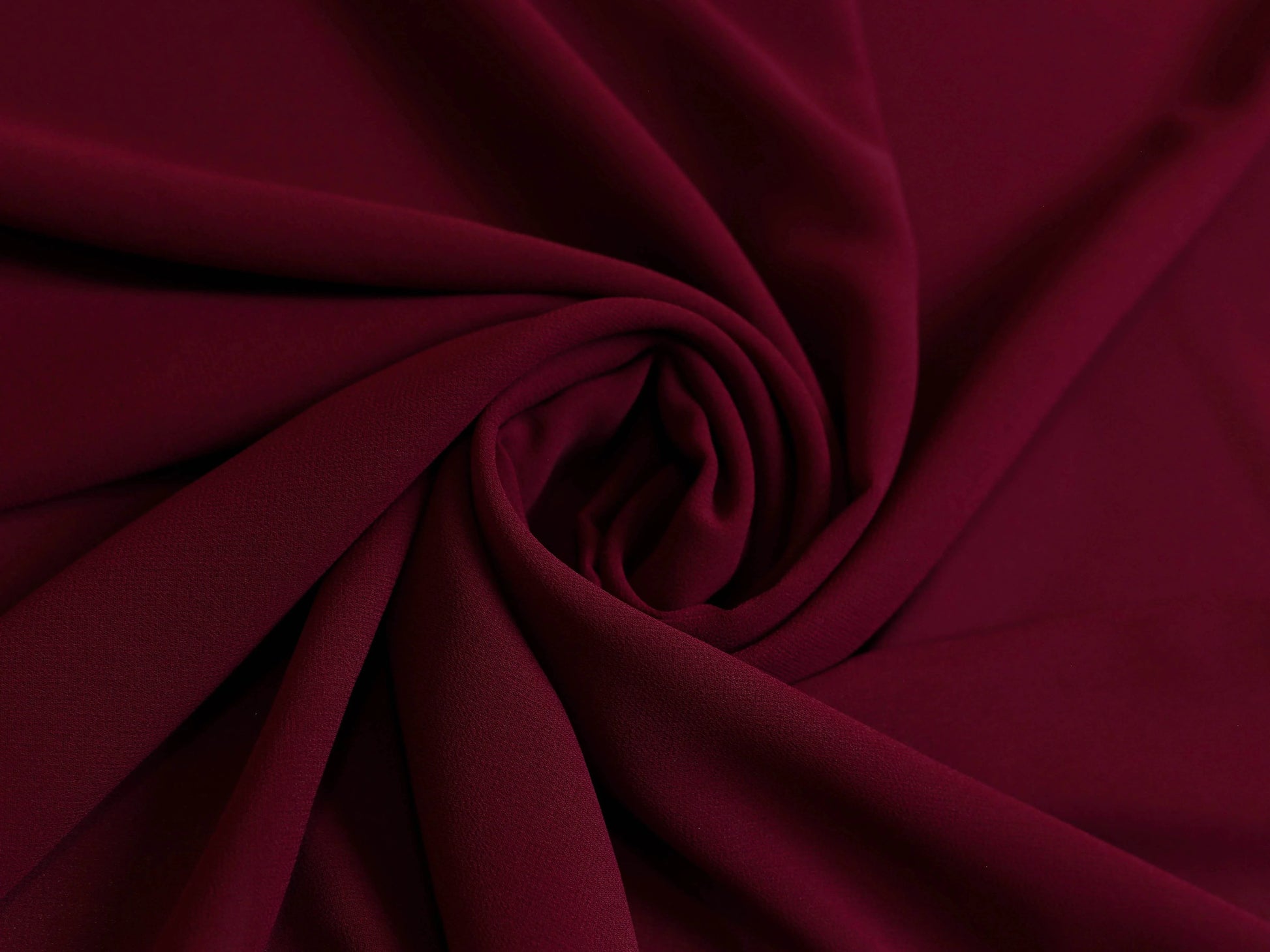 Plain maroon georgette hijab draped elegantly