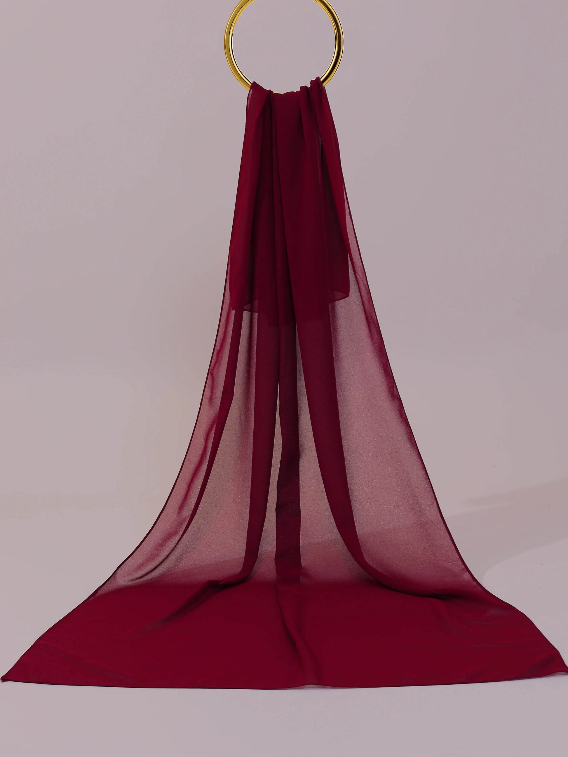 Deep maroon georgette fabric close-up texture